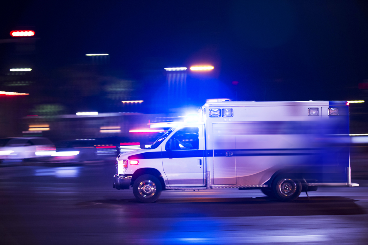 Ambulance speeding to take a victim to a doctor after a car accident
